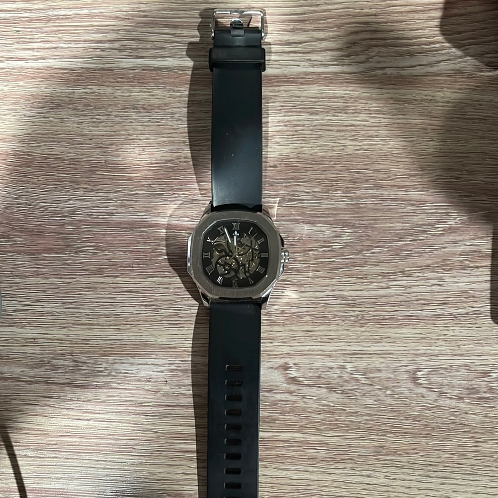 Men’s Stainless Steel Ralph Christian watch with black rubber band.